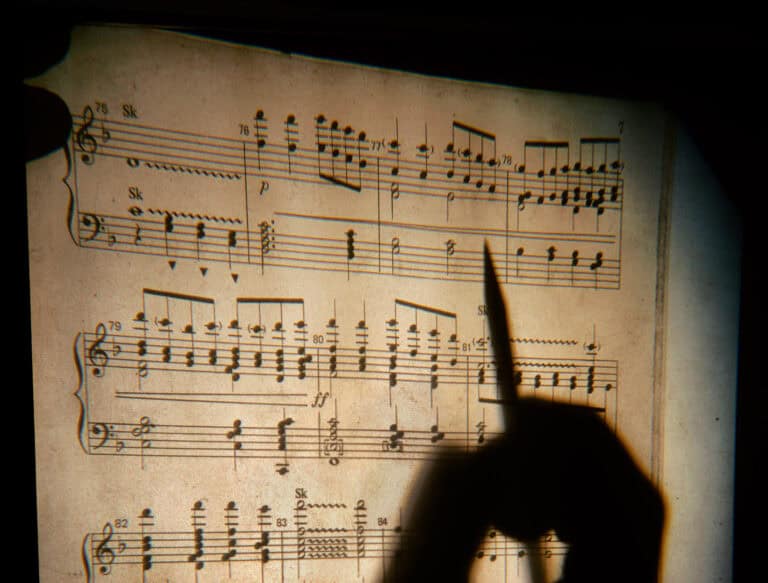 A person holding a pencil.